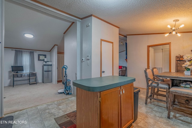 384 Lancer Rd, Harriman, TN 37748 - kitchen with fridge, crown molding, a chandelier, light carpet, and vaulted ceiling