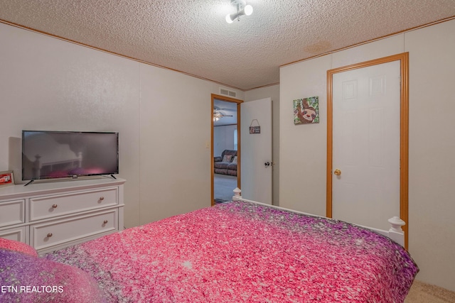 384 Lancer Rd, Harriman, TN 37748 - bedroom featuring a textured ceiling and carpet flooring