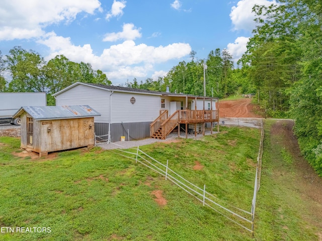 384 Lancer Rd, Harriman, TN 37748 - rear view of property with stairway, a deck, and an outbuilding