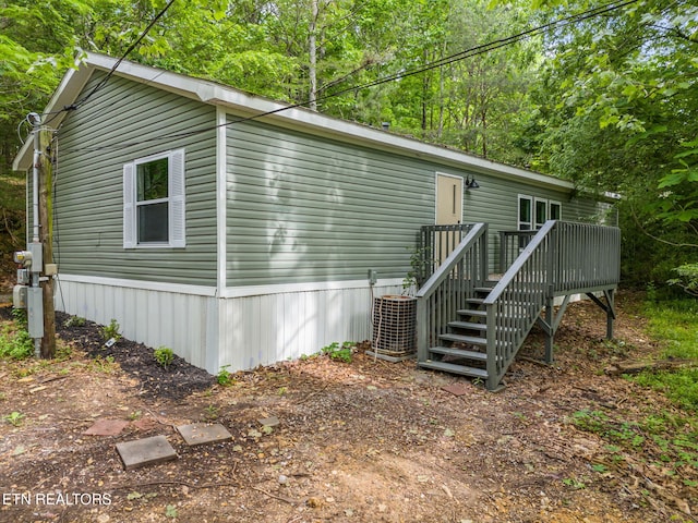 4817 Howardsville Rd, Apison, TN 37302 - view of home's exterior featuring central air condition unit and a deck