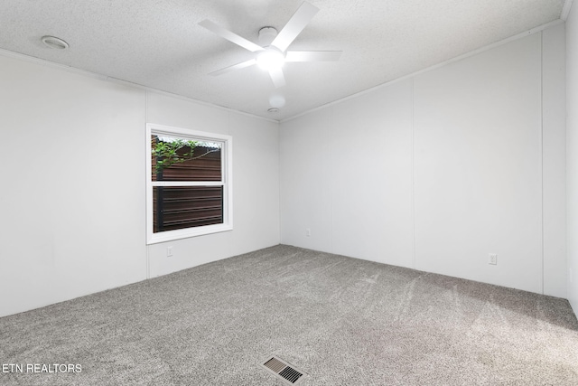 4817 Howardsville Rd, Apison, TN 37302 - empty room featuring carpet floors, ceiling fan, a textured ceiling, and crown molding