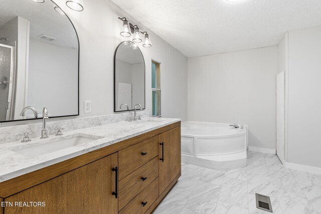 4817 Howardsville Rd, Apison, TN 37302 - full bathroom with a textured ceiling, marble finish flooring, a bath, double vanity, and an enclosed shower