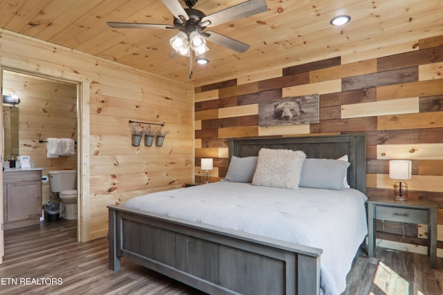 bedroom with wood walls, wooden ceiling, wood finished floors, and recessed lighting