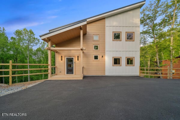view of home's exterior with fence