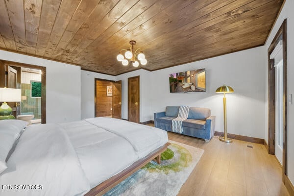 bedroom featuring wooden ceiling, wood finished floors, a chandelier, baseboards, and connected bathroom