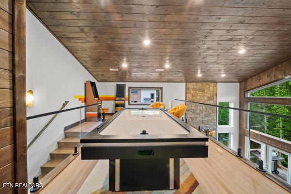 recreation room with wood finished floors, wooden ceiling, and recessed lighting