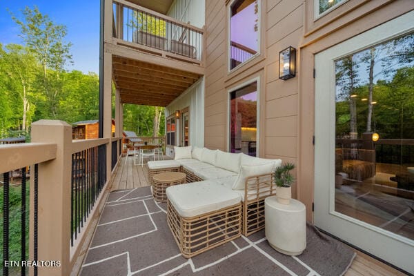 view of patio with a balcony and outdoor lounge area