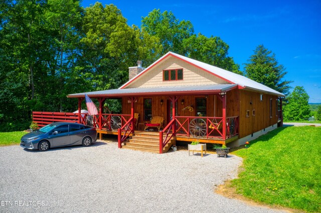 305 Griffin Ln, Allardt, TN 38504 - view of front facade with a porch, a chimney, and a front yard
