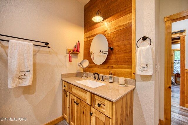 305 Griffin Ln, Allardt, TN 38504 - bathroom featuring vanity, a textured wall, baseboards, and wood finished floors