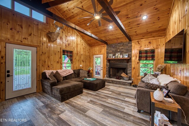 305 Griffin Ln, Allardt, TN 38504 - living area featuring plenty of natural light, hardwood / wood-style flooring, wooden walls, ceiling fan, and high vaulted ceiling