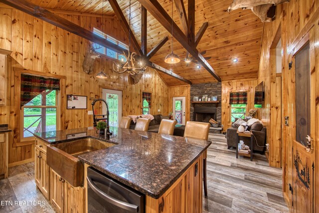 305 Griffin Ln, Allardt, TN 38504 - kitchen featuring dishwasher, wooden ceiling with exposed beams, plenty of natural light, wooden walls, and wood finished floors