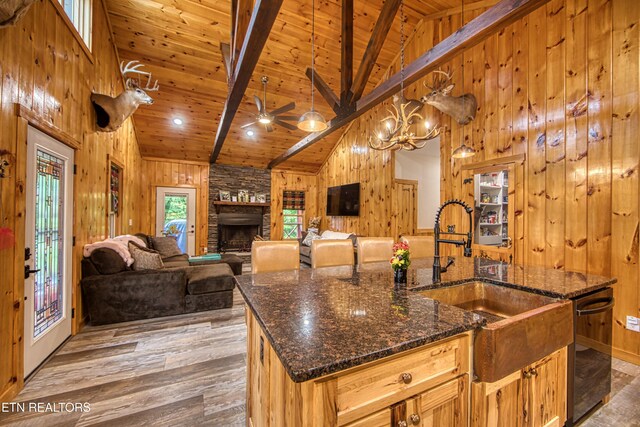 305 Griffin Ln, Allardt, TN 38504 - kitchen with a sink, high vaulted ceiling, wood walls, wooden ceiling with exposed beams, and black dishwasher