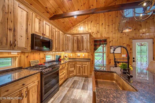 305 Griffin Ln, Allardt, TN 38504 - kitchen with stainless steel appliances, a sink, light wood-style flooring, wooden walls, and wood ceiling