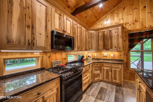 305 Griffin Ln, Allardt, TN 38504 - kitchen with black range with gas stovetop, wood finished floors, wooden walls, wooden ceiling, and dark stone counters
