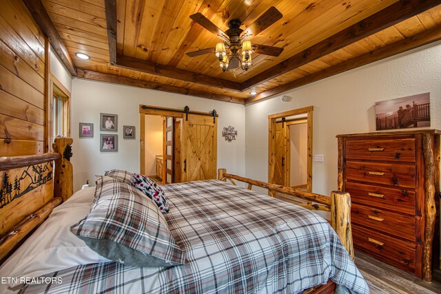 305 Griffin Ln, Allardt, TN 38504 - bedroom with a barn door, wood ceiling, wood finished floors, and recessed lighting