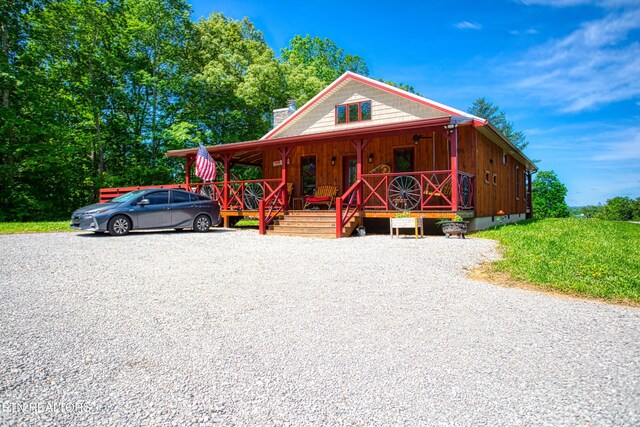 305 Griffin Ln, Allardt, TN 38504 - view of front of house with a porch, a chimney, and board and batten siding