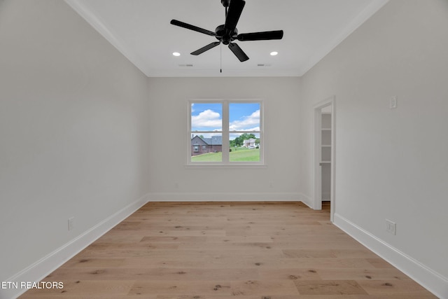 empty room featuring ornamental molding, light wood-style flooring, baseboards, a ceiling fan, and recessed lighting