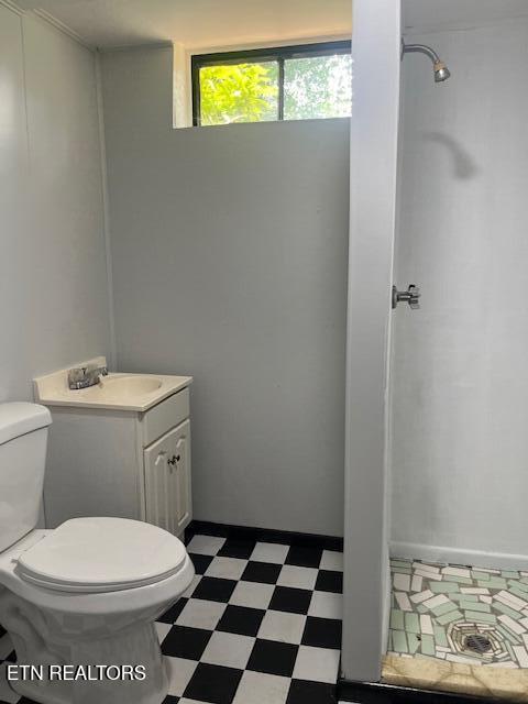 1634 Snodderly Dr, Lenoir City, TN 37771 - bathroom with tile patterned floors, toilet, vanity, and a shower