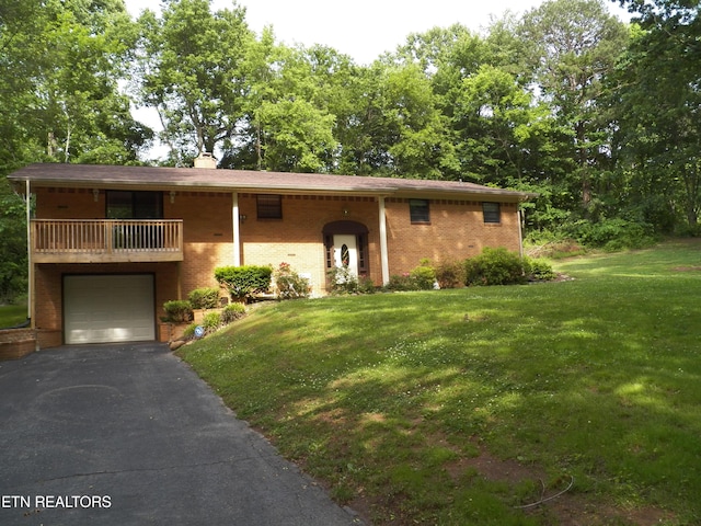 1634 Snodderly Dr, Lenoir City, TN 37771 - view of front of house featuring brick siding, a front lawn, a balcony, and driveway