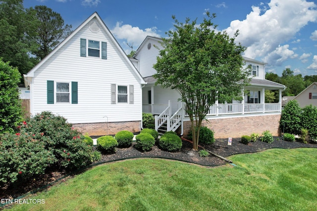 1023 NE Old Charleston Rd, Cleveland, TN 37312 - rear view of property with a yard and covered porch