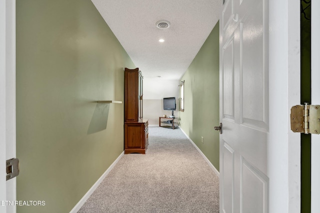 1023 NE Old Charleston Rd, Cleveland, TN 37312 - hall with carpet, baseboards, and a textured ceiling
