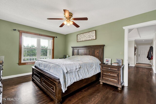 1023 NE Old Charleston Rd, Cleveland, TN 37312 - bedroom featuring baseboards, dark wood-style flooring, and a ceiling fan