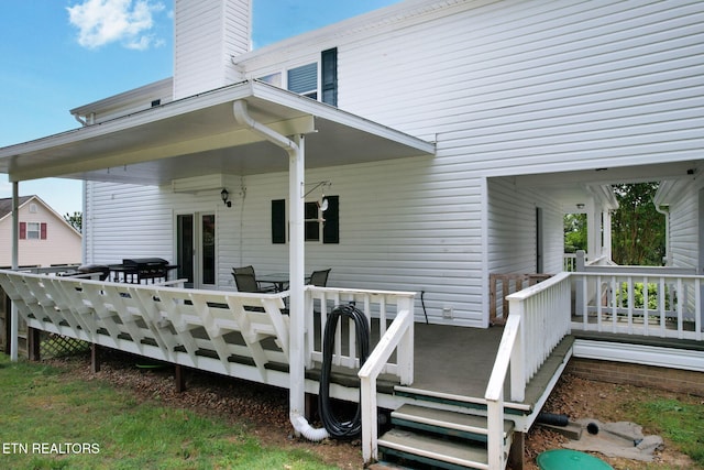 1023 NE Old Charleston Rd, Cleveland, TN 37312 - back of house with a wooden deck and a chimney
