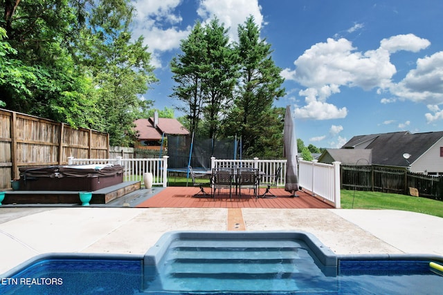 1023 NE Old Charleston Rd, Cleveland, TN 37312 - view of swimming pool with a hot tub, a fenced backyard, a wooden deck, a patio, and outdoor dining space