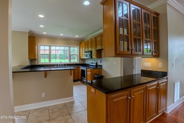 1419 Cheyenne Blvd, Seymour, TN 37865 - kitchen with appliances with stainless steel finishes, ornamental molding, a peninsula, a sink, and glass insert cabinets