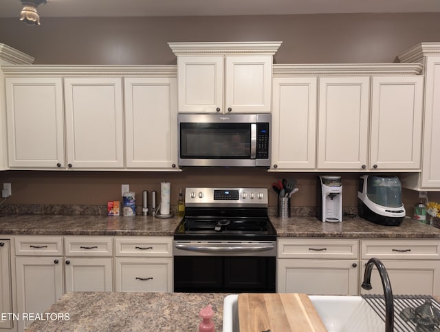 900 Twin Fawn Trl, Middlesboro, KY 40965 - kitchen with appliances with stainless steel finishes, a sink, and white cabinets