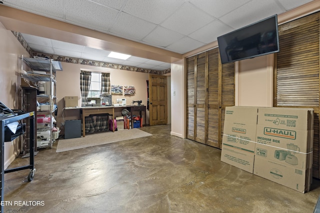 below grade area with a paneled ceiling