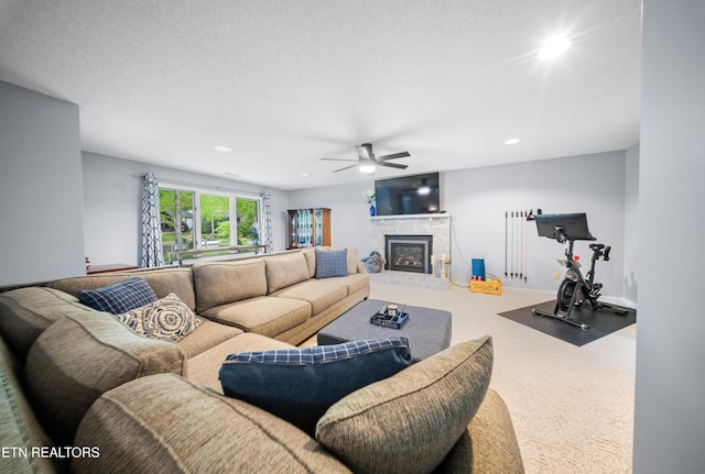 118 Motthaven Dr, Crossville, TN 38558 - living room featuring a fireplace with raised hearth, ceiling fan, and recessed lighting