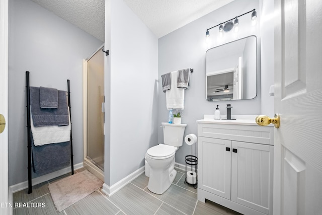 118 Motthaven Dr, Crossville, TN 38558 - bathroom with a stall shower, toilet, vanity, and baseboards