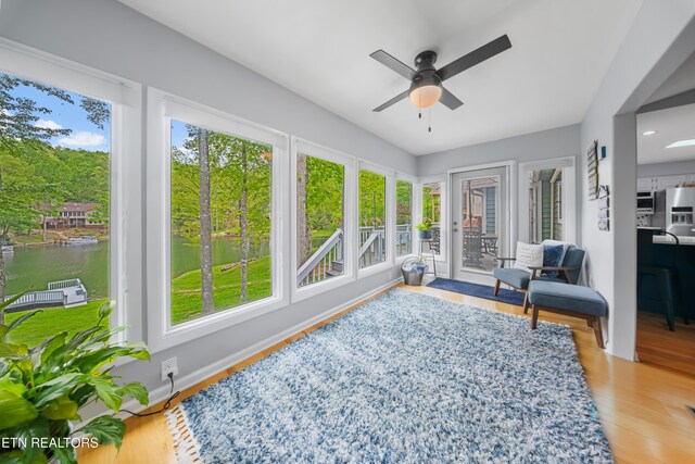 118 Motthaven Dr, Crossville, TN 38558 - sunroom / solarium featuring plenty of natural light, a water view, and wood finished floors