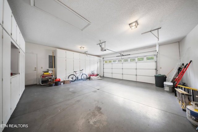 118 Motthaven Dr, Crossville, TN 38558 - garage with electric panel and a garage door opener