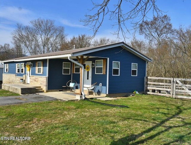 217 Yoakum Rd, Speedwell, TN 37870 - view of front facade with metal roof and a patio