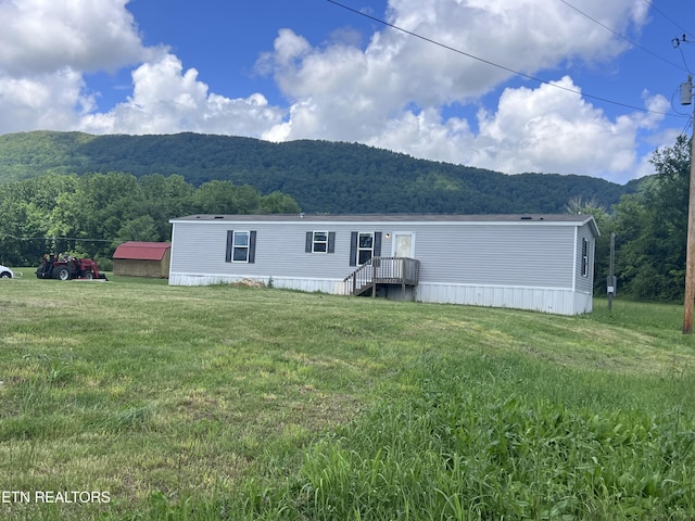 225 Orange Ln, Speedwell, TN 37870 - rear view of house with a mountain view and a lawn