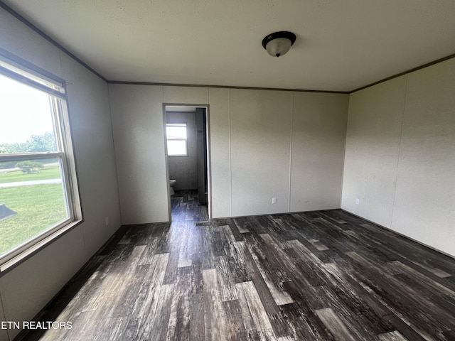 225 Orange Ln, Speedwell, TN 37870 - empty room featuring dark wood-style floors and ornamental molding