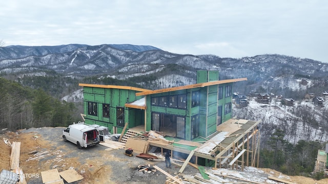 view of side of home with a mountain view