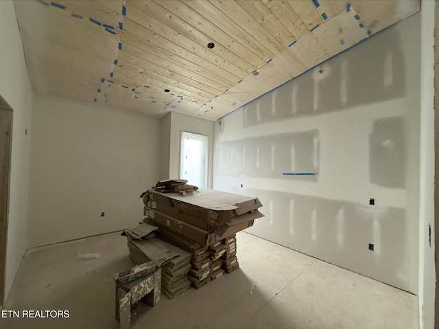 miscellaneous room featuring concrete flooring and wood ceiling