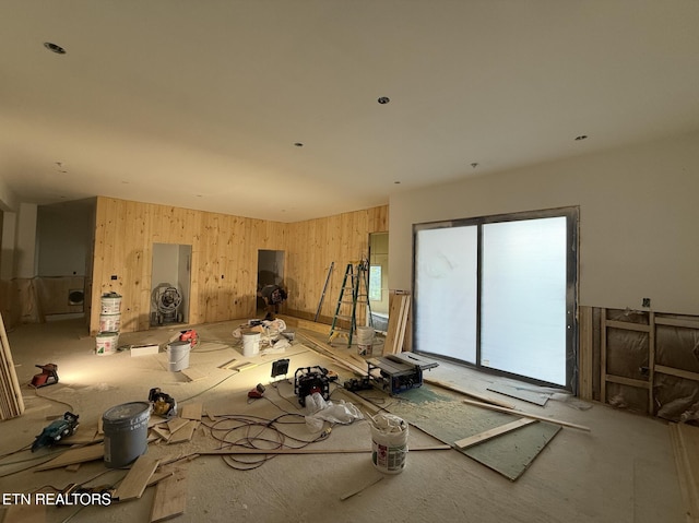 miscellaneous room featuring wooden walls