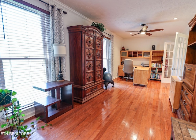 112 Chestnut Hill Rd, Oak Ridge, TN 37830 - office area with crown molding, ceiling fan, french doors, light wood-style flooring, and a textured ceiling