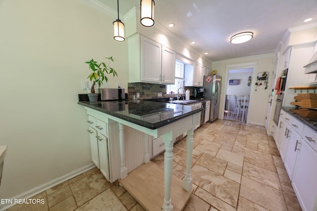 112 Chestnut Hill Rd, Oak Ridge, TN 37830 - kitchen featuring ornamental molding, freestanding refrigerator, backsplash, stone tile floors, and baseboards