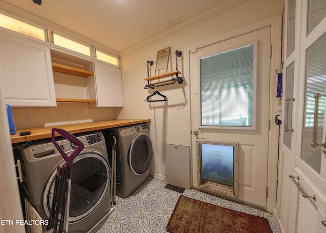 112 Chestnut Hill Rd, Oak Ridge, TN 37830 - washroom featuring washer and dryer, cabinet space, light tile patterned floors, and ornamental molding