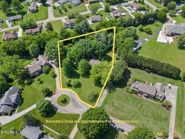 aerial perspective of suburban area with property parcel outlined