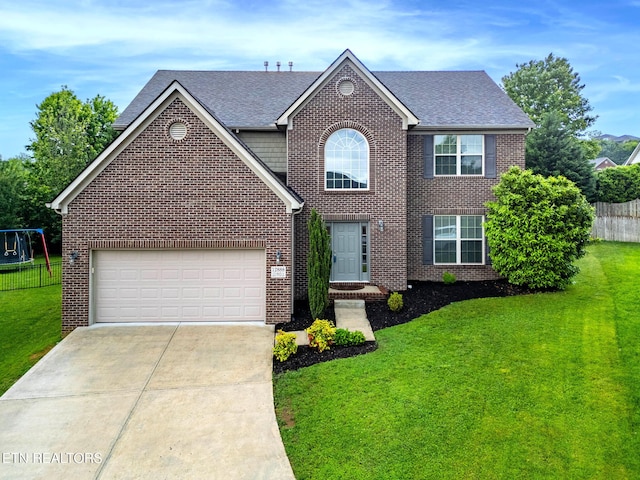 12888 Lily Pond Ln, Knoxville, TN 37922 - view of front of property featuring brick siding, driveway, a shingled roof, and a garage