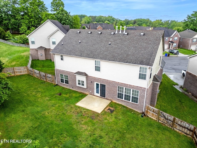 12888 Lily Pond Ln, Knoxville, TN 37922 - rear view of house featuring a patio area, brick siding, a residential view, and a shingled roof