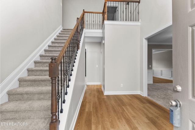 12888 Lily Pond Ln, Knoxville, TN 37922 - staircase featuring a towering ceiling, wood finished floors, and baseboards