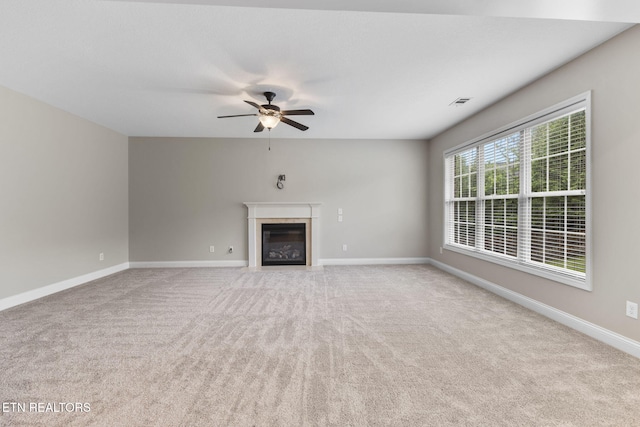 12888 Lily Pond Ln, Knoxville, TN 37922 - unfurnished living room with carpet floors, a fireplace with flush hearth, a ceiling fan, and baseboards