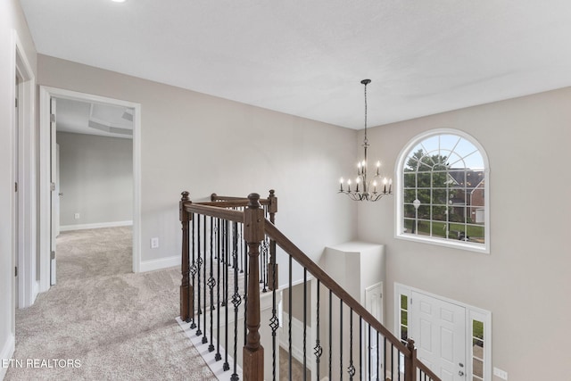 12888 Lily Pond Ln, Knoxville, TN 37922 - corridor with an upstairs landing, carpet floors, a chandelier, and baseboards